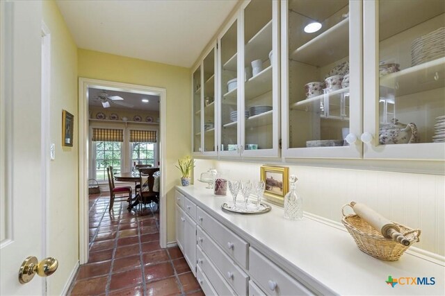 13650 Blackberry Rd, Salado, TX 76571 - bar with dark tile patterned floors and a ceiling fan