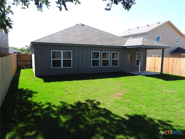 1421 Lindsey Dr, Copperas Cove, TX 76522 - rear view of house with board and batten siding, a patio area, and a shingled roof
