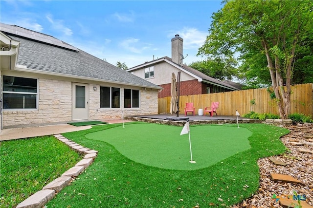 view of yard featuring a patio and fence