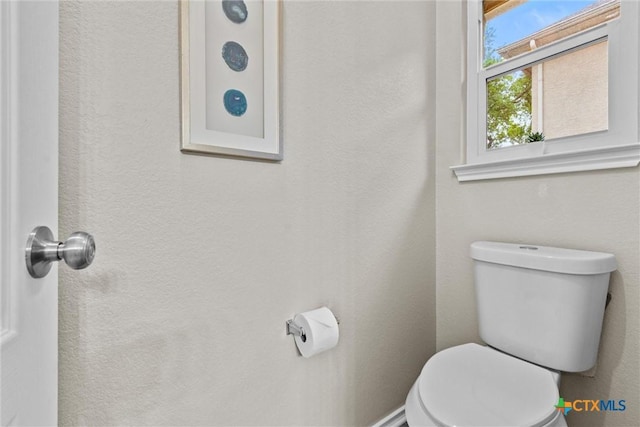 bathroom featuring toilet
