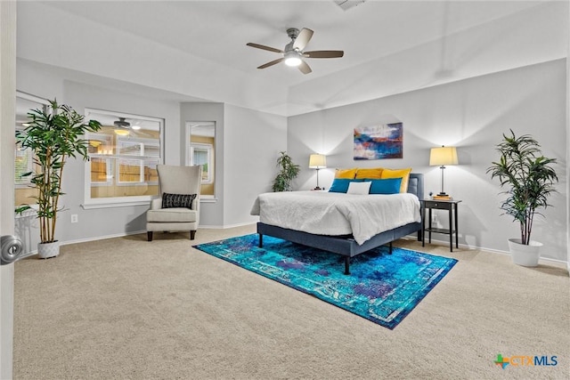 bedroom featuring baseboards, visible vents, ceiling fan, and carpet