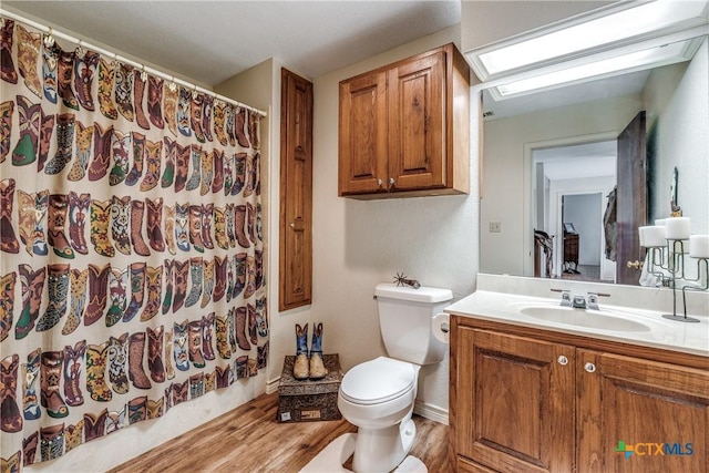 10767 Rosemar Ln, Adkins, TX 78101 - full bathroom featuring vanity, wood finished floors, and a shower with curtain