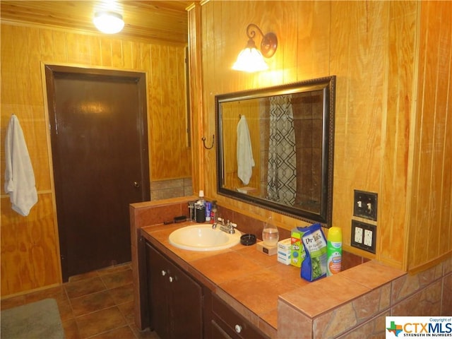 bathroom with tile patterned floors and vanity