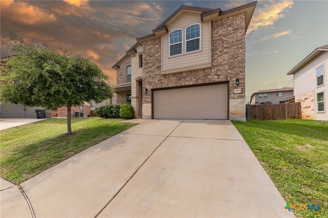 3303 Lorne Dr, Killeen, TX 76542 - traditional-style home with a garage, stone siding, concrete driveway, and brick siding