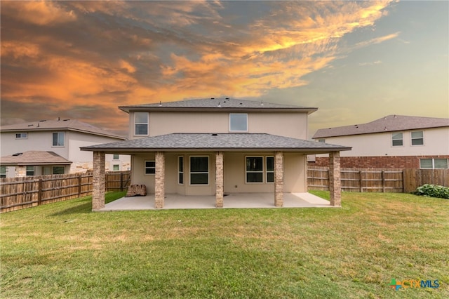 3303 Lorne Dr, Killeen, TX 76542 - back of property at dusk with a patio and stucco siding