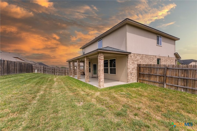 3303 Lorne Dr, Killeen, TX 76542 - rear view of house featuring a patio area, stucco siding, and brick siding
