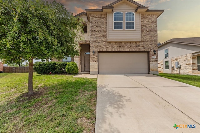 3303 Lorne Dr, Killeen, TX 76542 - traditional-style house with a garage, brick siding, a lawn, and driveway