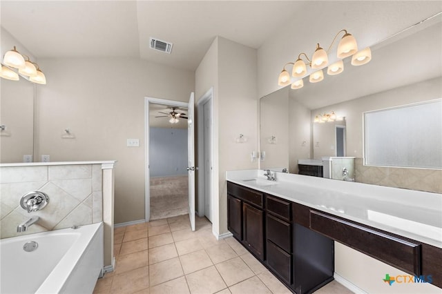 3303 Lorne Dr, Killeen, TX 76542 - full bath with tile patterned floors, a garden tub, a ceiling fan, double vanity, and vaulted ceiling