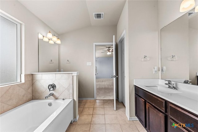 3303 Lorne Dr, Killeen, TX 76542 - bathroom featuring a garden tub, lofted ceiling, vanity, ceiling fan, and tile patterned flooring