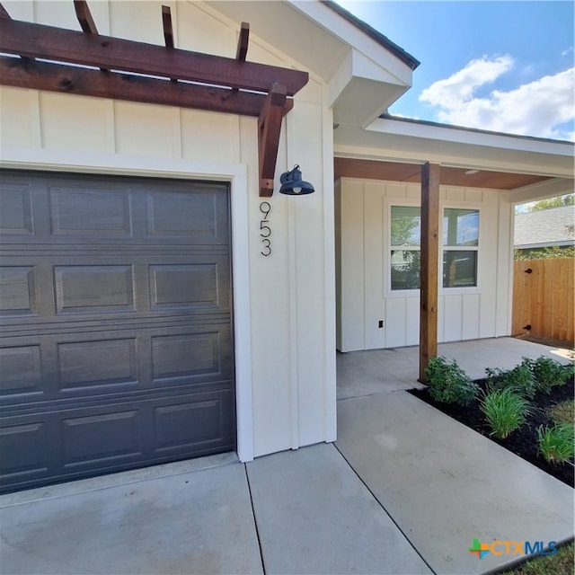 view of exterior entry featuring a garage