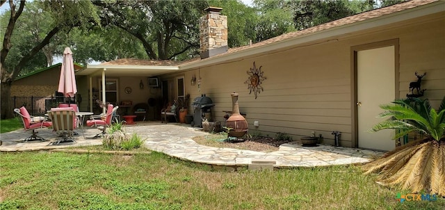 130 Twin Oak Rd, Seguin, TX 78155 - rear view of property with a patio area and a chimney