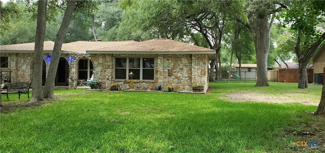 130 Twin Oak Rd, Seguin, TX 78155 - view of front facade featuring stone siding, a shingled roof, and central air condition unit