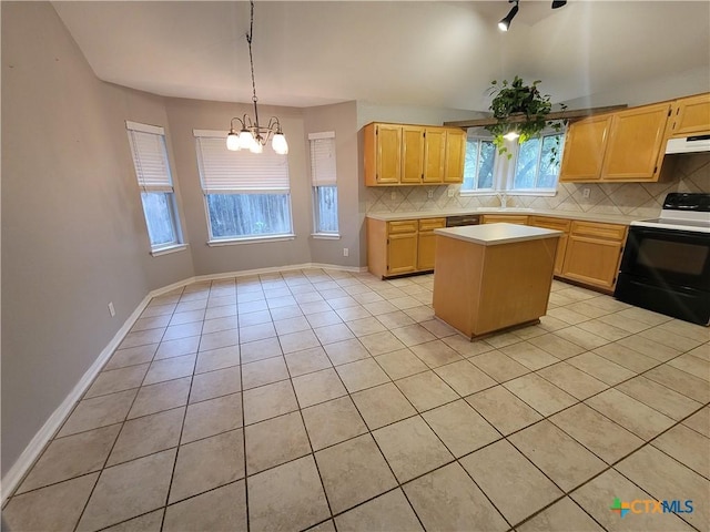 3803 Canyon Heights Rd, Belton, TX 76513 - kitchen featuring light countertops, tasteful backsplash, a center island, range with electric stovetop, and a notable chandelier