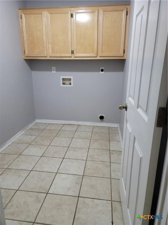 3803 Canyon Heights Rd, Belton, TX 76513 - clothes washing area featuring light tile patterned floors, hookup for a washing machine, baseboards, cabinet space, and electric dryer hookup