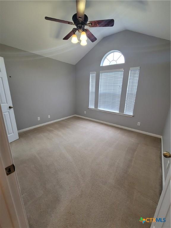 3803 Canyon Heights Rd, Belton, TX 76513 - carpeted empty room featuring baseboards, vaulted ceiling, and a ceiling fan