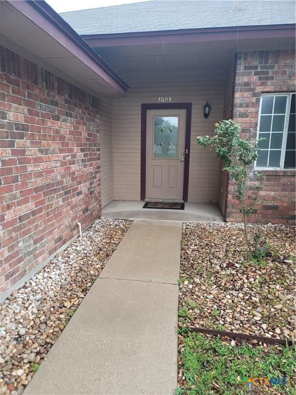 3803 Canyon Heights Rd, Belton, TX 76513 - doorway to property with brick siding