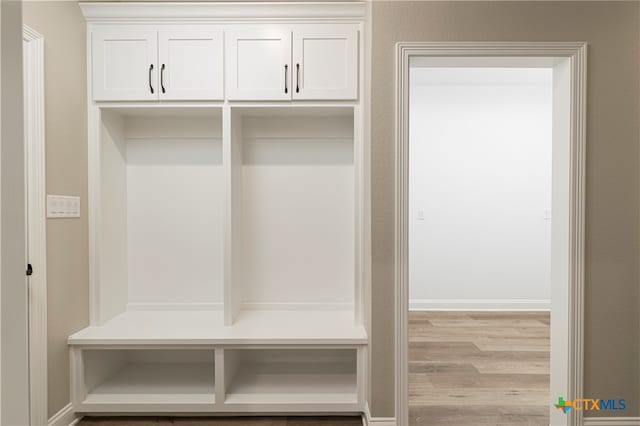 mudroom with light hardwood / wood-style floors