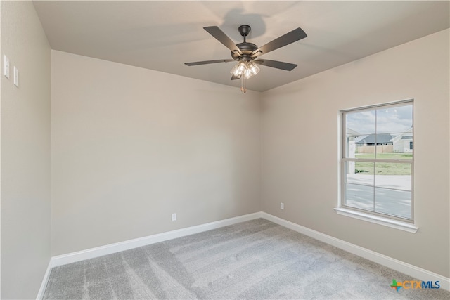 unfurnished room with ceiling fan and carpet floors