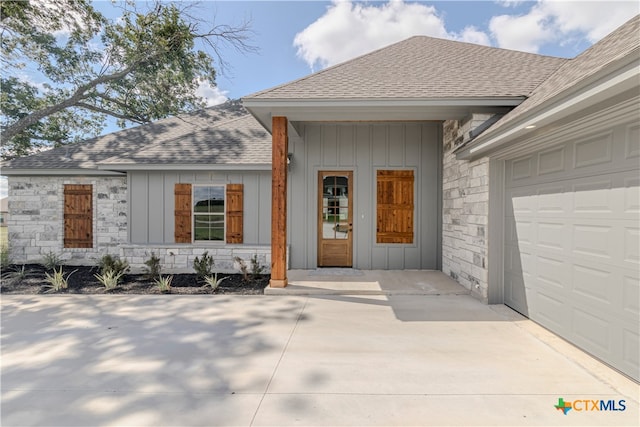 entrance to property featuring a garage