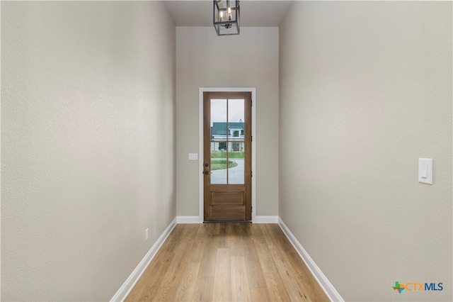 doorway to outside with light hardwood / wood-style floors