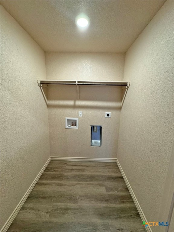 clothes washing area featuring electric dryer hookup, dark hardwood / wood-style flooring, a textured ceiling, and hookup for a washing machine