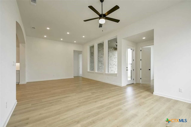 unfurnished living room featuring light wood-type flooring and ceiling fan