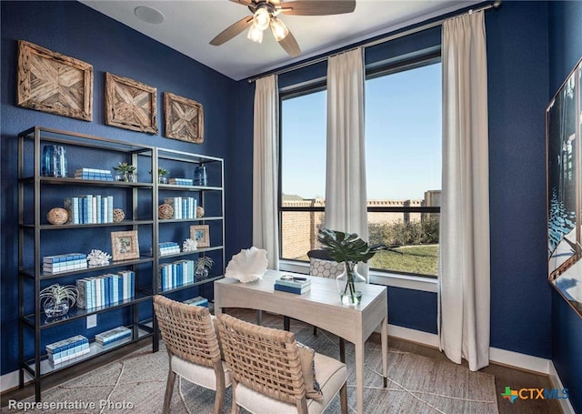 office with hardwood / wood-style flooring and ceiling fan