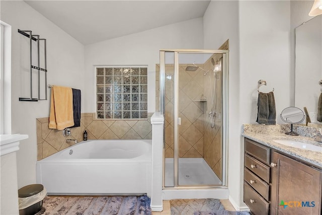 709 Rowdy Dr, Killeen, TX 76542 - full bath featuring lofted ceiling, a bath, a stall shower, vanity, and wood finished floors