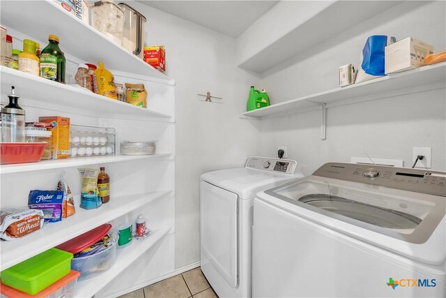 709 Rowdy Dr, Killeen, TX 76542 - washroom featuring separate washer and dryer and tile patterned floors