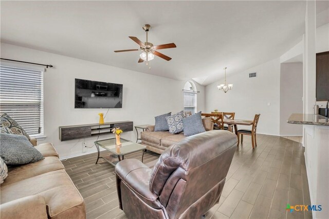 709 Rowdy Dr, Killeen, TX 76542 - living area with wood finished floors, lofted ceiling, a chandelier, ceiling fan, and baseboards