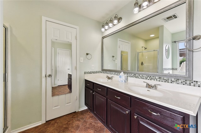 211 Gettysburg Loop, Elgin, TX 78621 - full bathroom featuring tile patterned floors, visible vents, a shower stall, and a sink