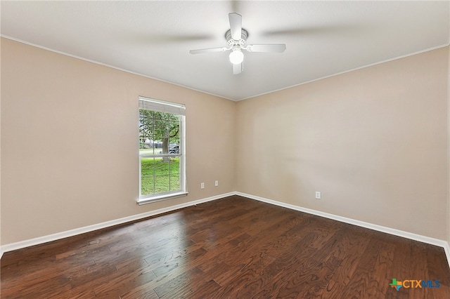211 Gettysburg Loop, Elgin, TX 78621 - spare room featuring crown molding, dark wood-type flooring, baseboards, and a ceiling fan