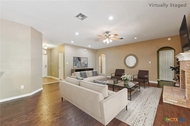 211 Gettysburg Loop, Elgin, TX 78621 - living room with recessed lighting, baseboards, visible vents, arched walkways, and hardwood / wood-style floors