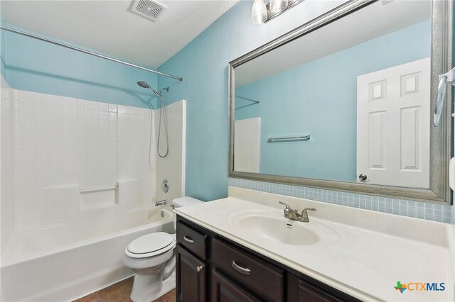 211 Gettysburg Loop, Elgin, TX 78621 - full bathroom featuring toilet, tile patterned floors, visible vents, vanity, and shower / bathing tub combination
