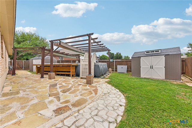211 Gettysburg Loop, Elgin, TX 78621 - view of yard with a patio area, a fenced backyard, and a storage unit