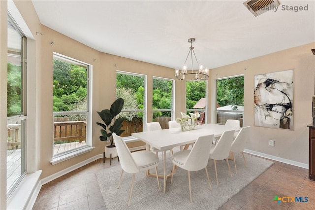 211 Gettysburg Loop, Elgin, TX 78621 - tiled dining area featuring a notable chandelier, baseboards, and visible vents