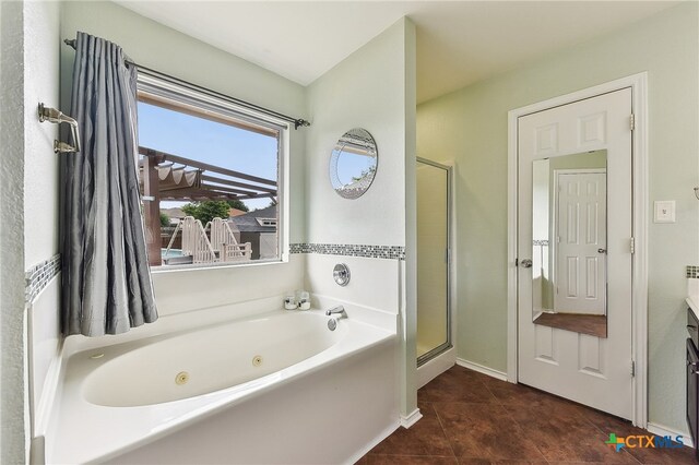 211 Gettysburg Loop, Elgin, TX 78621 - full bathroom featuring tile patterned floors, a tub with jets, vanity, and a shower stall