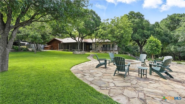119 Stageline Dr, Kyle, TX 78640 - view of green lawn featuring an outdoor fire pit and a patio