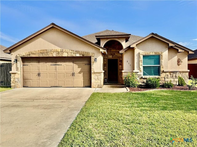 view of front facade with a garage and a front lawn