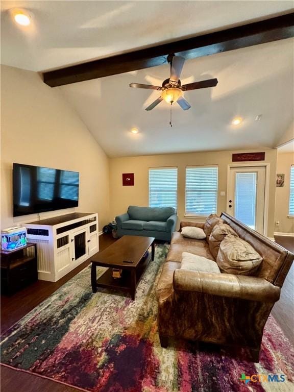 living room with lofted ceiling with beams, ceiling fan, and dark wood-type flooring