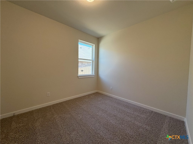 empty room featuring carpet floors