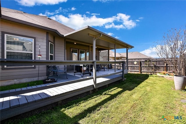 exterior space featuring fence and a wooden deck