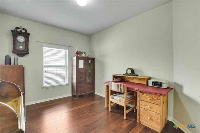 office area with baseboards and dark wood-style flooring