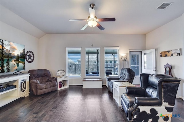 living area with visible vents, lofted ceiling, dark wood-style floors, and a ceiling fan