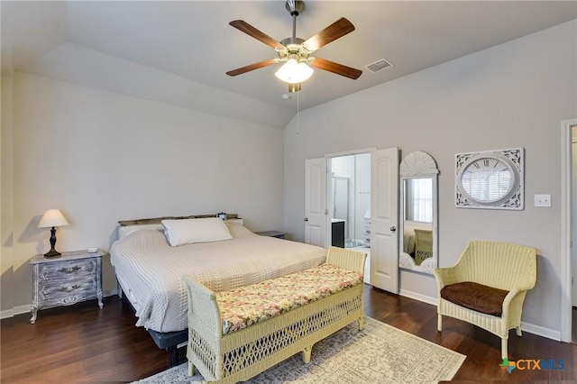 bedroom featuring vaulted ceiling, wood finished floors, visible vents, and baseboards