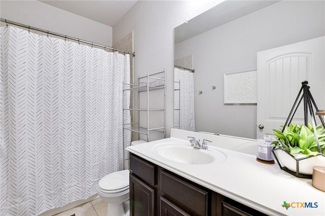 full bathroom featuring curtained shower, toilet, vanity, and tile patterned flooring