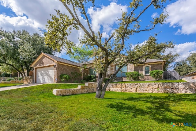 single story home featuring a garage and a front lawn