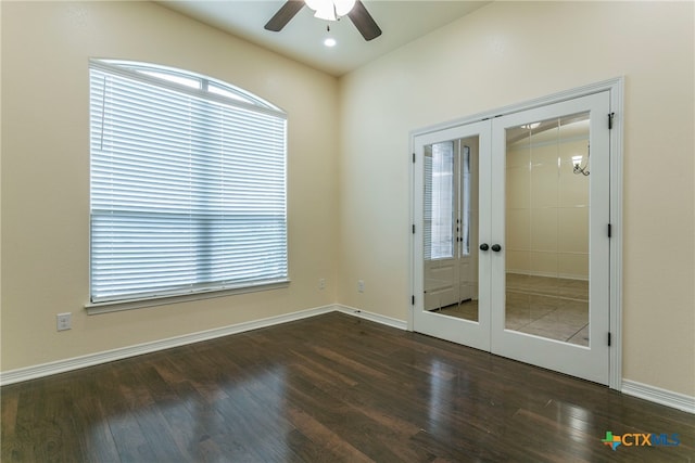 empty room featuring french doors and dark wood-type flooring