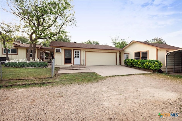 single story home featuring an attached garage, driveway, and fence