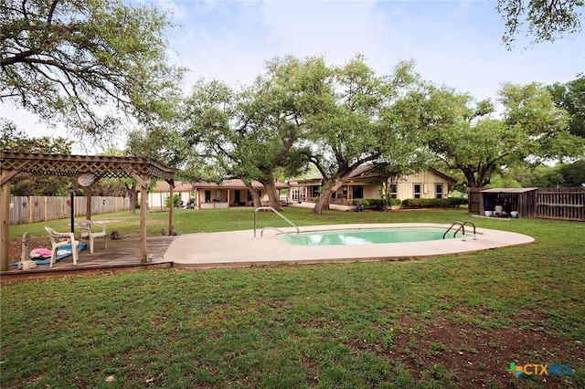 view of community with a swimming pool, a lawn, fence, a patio, and a wooden deck